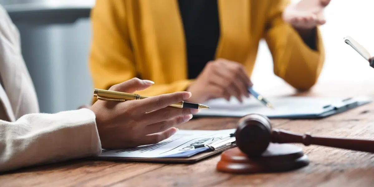 Safety professional reviewing an OSHA citation document with corrective action checklist