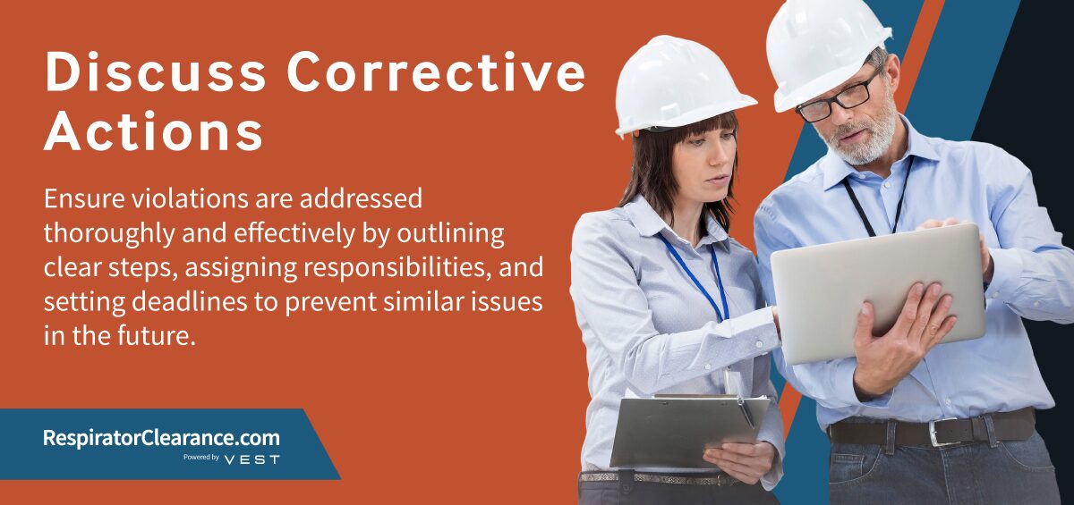 Two people discussing OSHA corrective actions