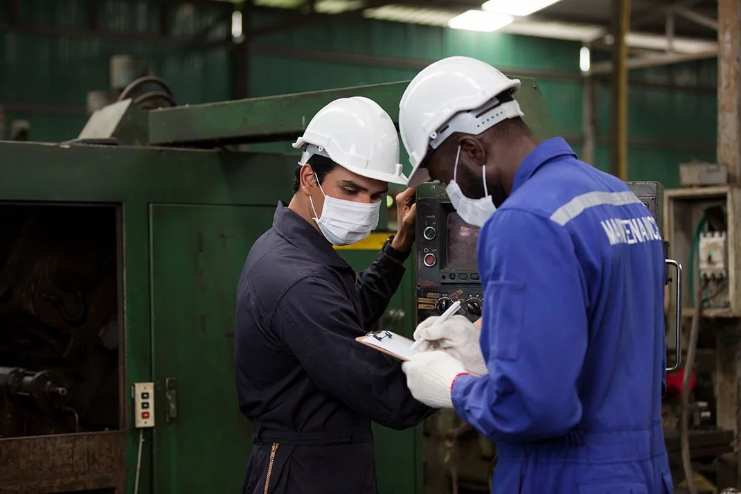 Industrial hygienist conducting breathing-zone air sampling on a worker