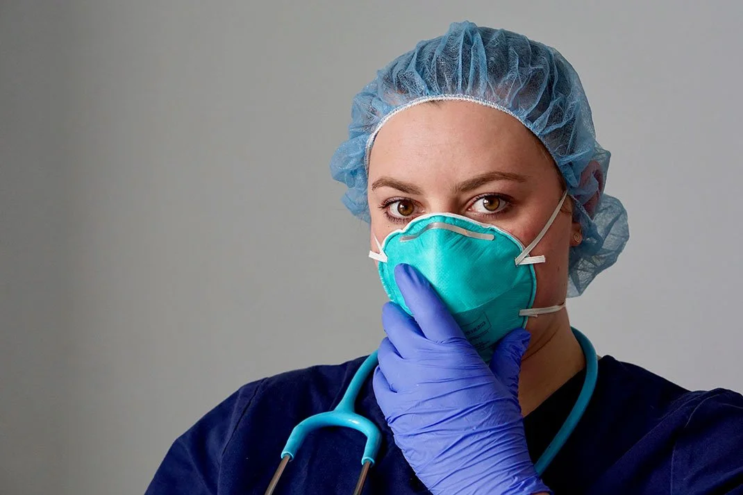 Nurse fit-tested with an N95 respirator at a hospital airborne infection isolation room